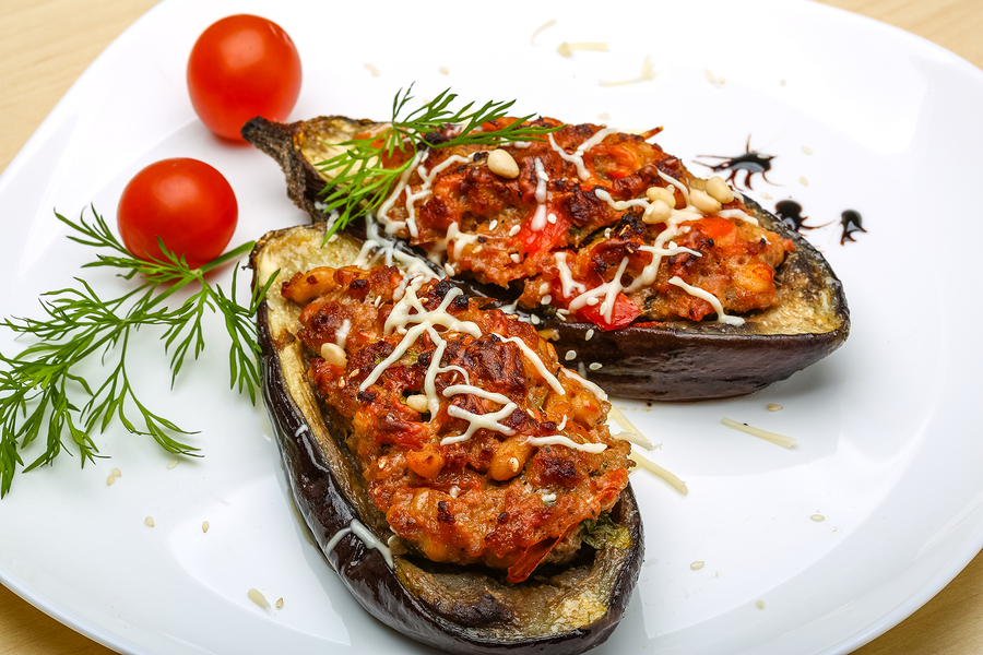 Eggplant stuffed minced meat with tomato cheese and herbs