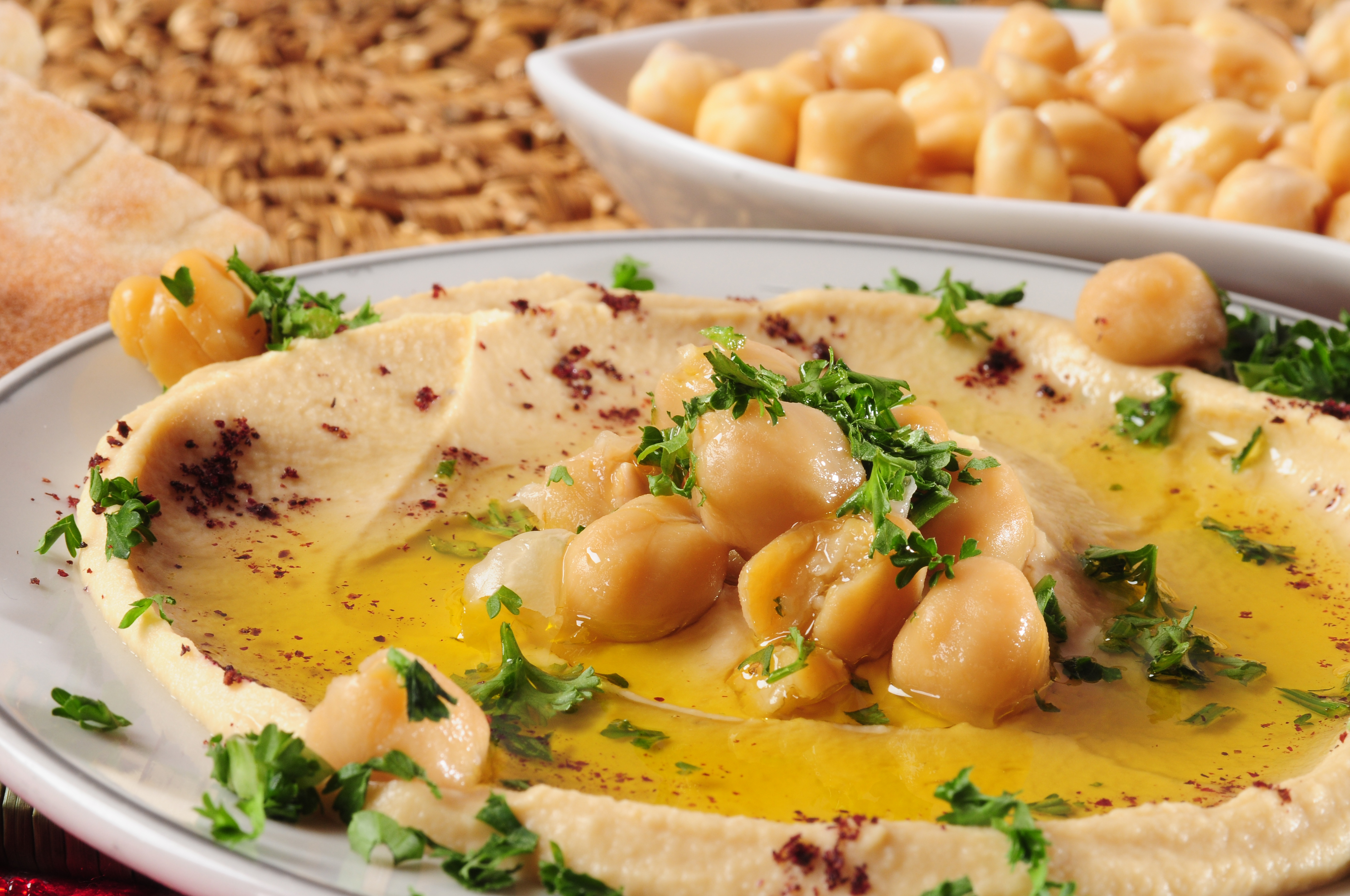 Mashed chickpeas with olive oil and pita bread on the side