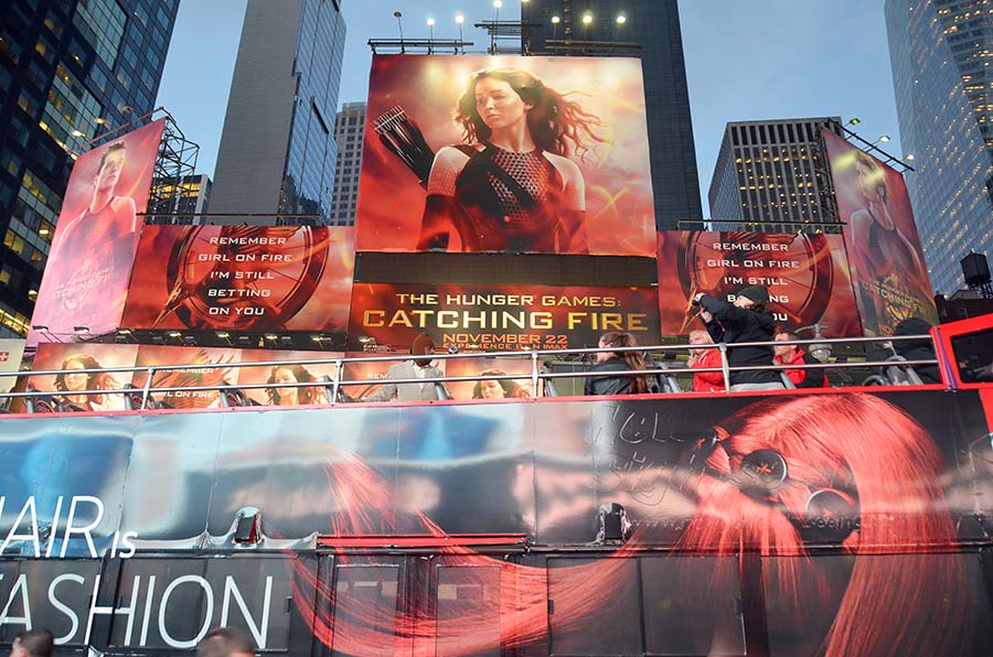 NEW YORK USA OCTOBER 27: Giant sign of The Hunger Games: Catching Fire movie in Time Square on October 27, 2013 in New York, Catching Fire, the second installment in The Hunger Games trilogy